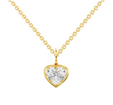 Gold necklace with a heart-shaped diamond pendant on a white background