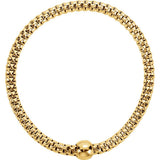 Gold bracelet with a spherical clasp on a white background