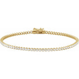 Gold bracelet with diamonds on a white background