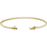 Gold bracelet with diamonds on a white background