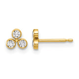 Gold earrings with three clear gemstones on a white background