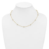 Gold necklace on a mannequin bust against a white background